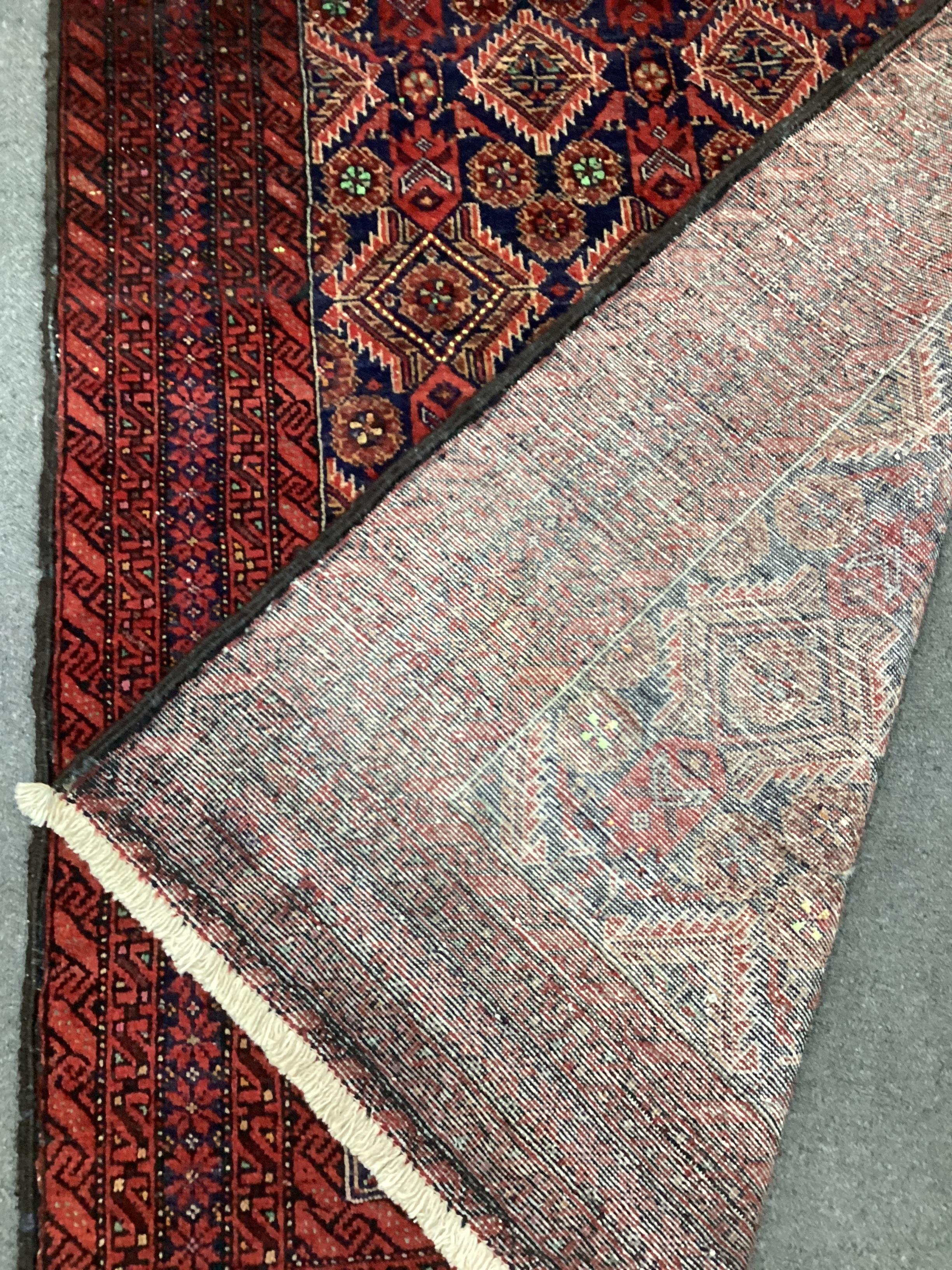 A Belouch blue ground rug, 170 x 106cm